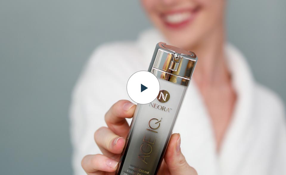 Video preview shot of a woman holding a Age IQ Night Cream Bottle